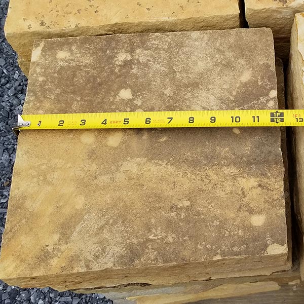 stack of flagstone steps with measuring tape