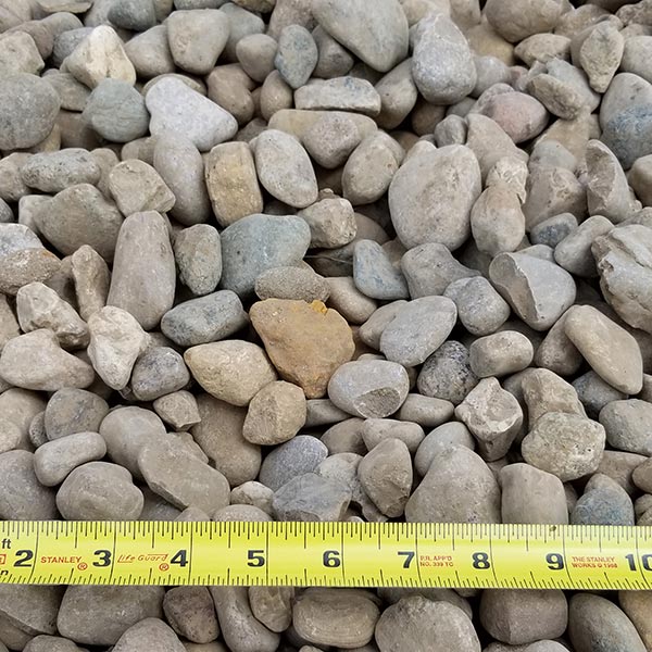 pile of small indian creek gravel with measuring tape