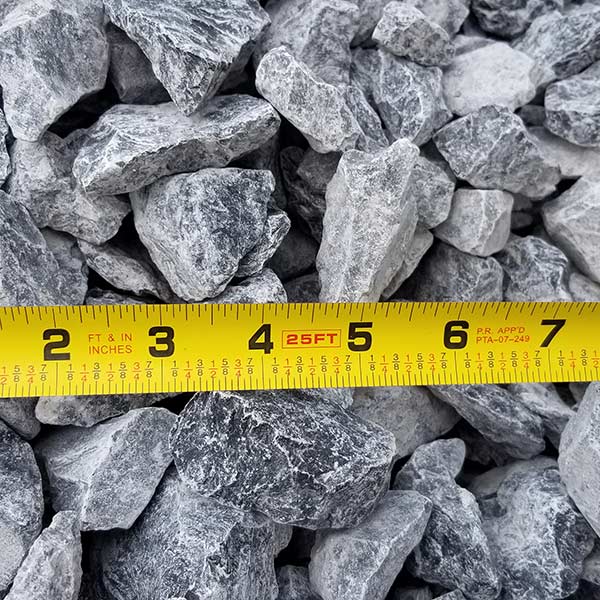 pile of #4 limestone with measuring tape